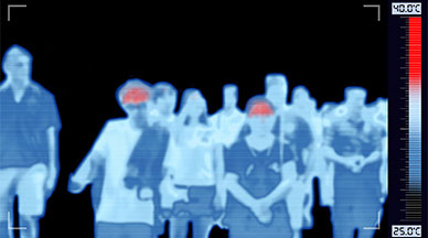 Thermal image of peole in a group and some with hot foreheads