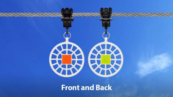 Two BirdMark bird diverters shown mounted on a power line, one showing the front and another showing the back.