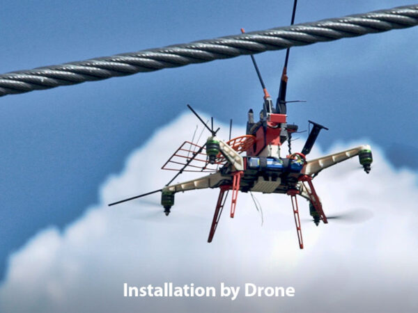 Drone shown installing a FireFly FF to a power line.