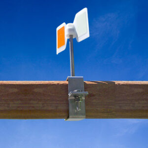 BirdAway bird hazing device shown mounted to a wooden pole.