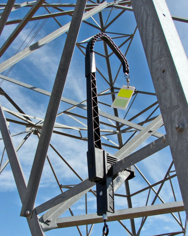 FireFly XA bird diverter shown mounted to a utility tower.