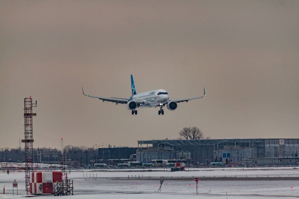 A plane landing on a runway