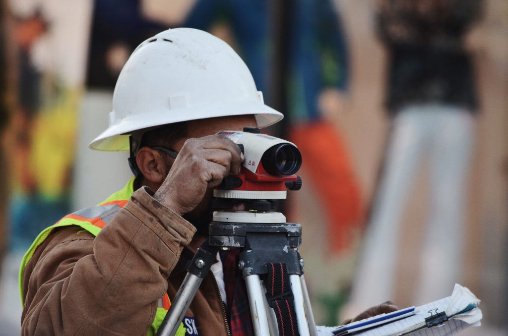 Construction worker surveying