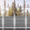 Ballistic Fence between concrete dividers.