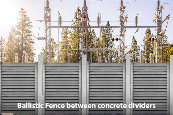 Ballistic Fence between concrete dividers.